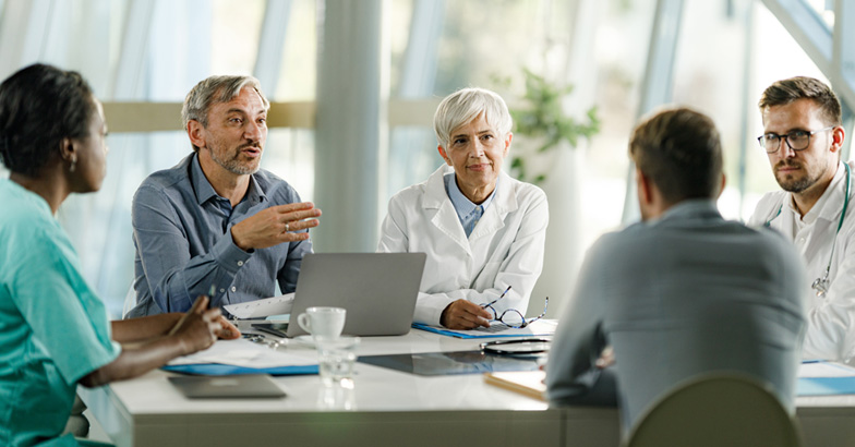 Healthcare leadership team meeting to discuss aged receivables strategy